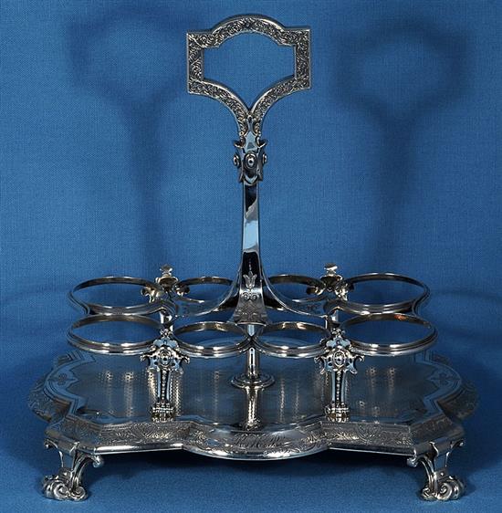 A Victorian silver eight bottle cruet stand and eight original bottles, by Walter & John Barnard, height 280mm, weight 40oz